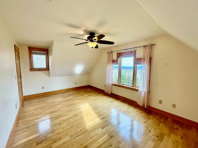 additional living space with ceiling fan, light hardwood / wood-style floors, and lofted ceiling