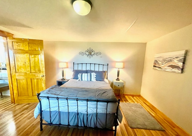 bedroom featuring hardwood / wood-style flooring