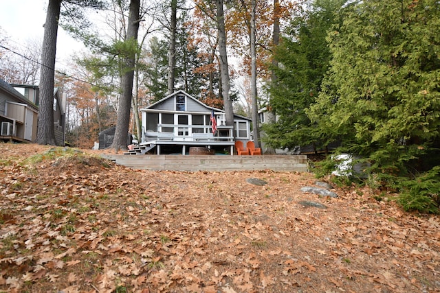 back of property with a deck