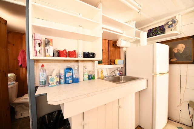 55 Lakeshore Dr, Casco, ME 04015 - kitchen featuring open shelves, a sink, and freestanding refrigerator