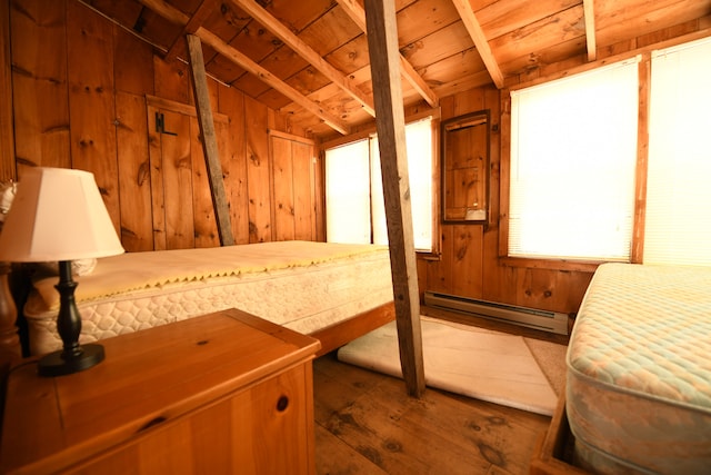 bedroom featuring a baseboard heating unit, dark hardwood / wood-style flooring, lofted ceiling, wood ceiling, and wood walls