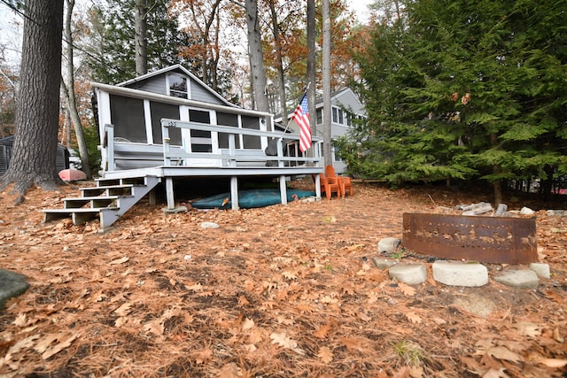 back of property featuring a deck