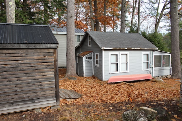 view of side of property with a shed