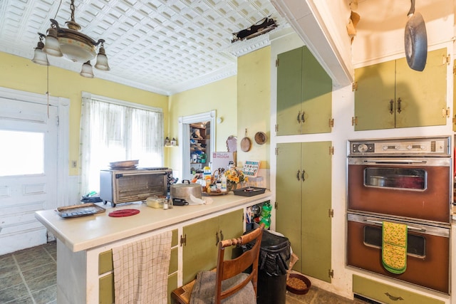 kitchen featuring crown molding and double oven