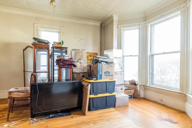 521 Main St, Sanford, ME 04083 - miscellaneous room featuring ornamental molding, plenty of natural light, wood-type flooring, and an ornate ceiling