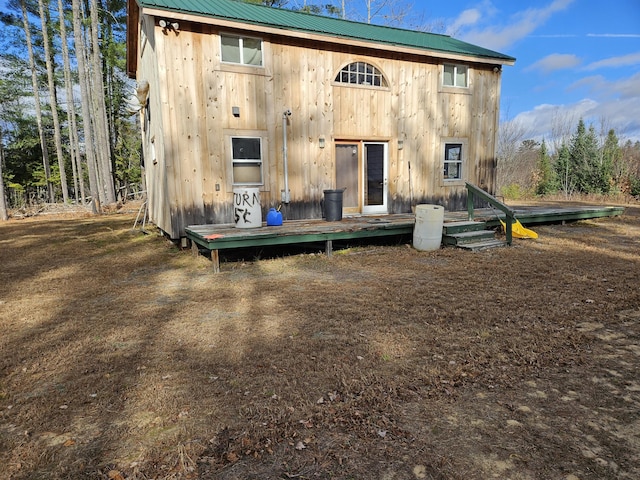 back of house featuring a wooden deck