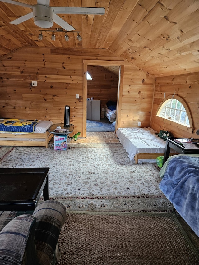 carpeted bedroom featuring lofted ceiling, wooden walls, ceiling fan, and wooden ceiling