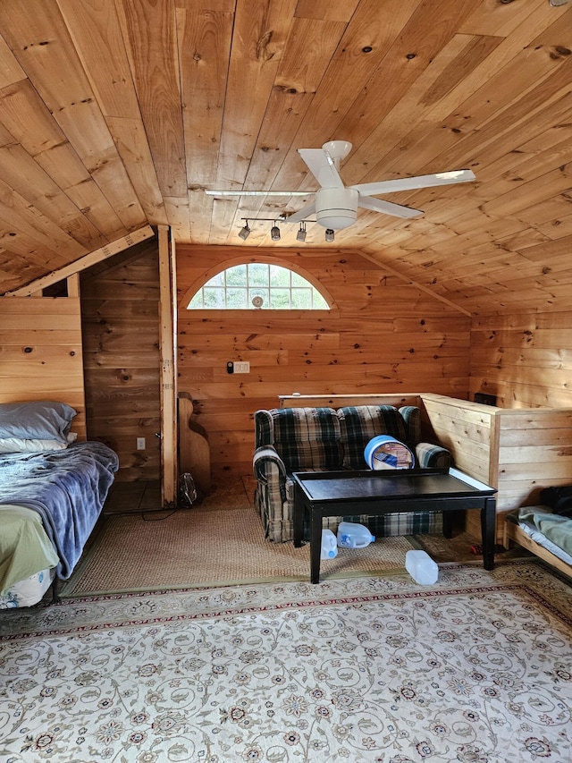 bedroom with wooden ceiling, wood walls, and vaulted ceiling