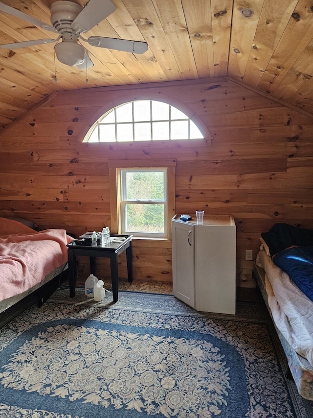 bedroom featuring wood walls, lofted ceiling, and wood ceiling