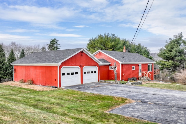 garage featuring a yard