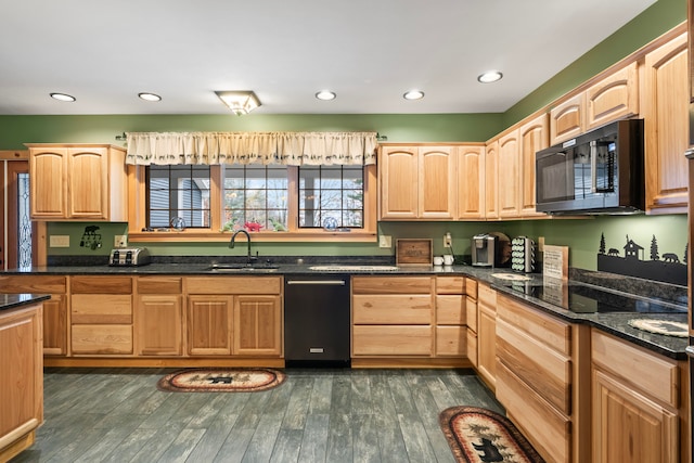 kitchen with dark hardwood / wood-style flooring, black appliances, sink, and dark stone counters