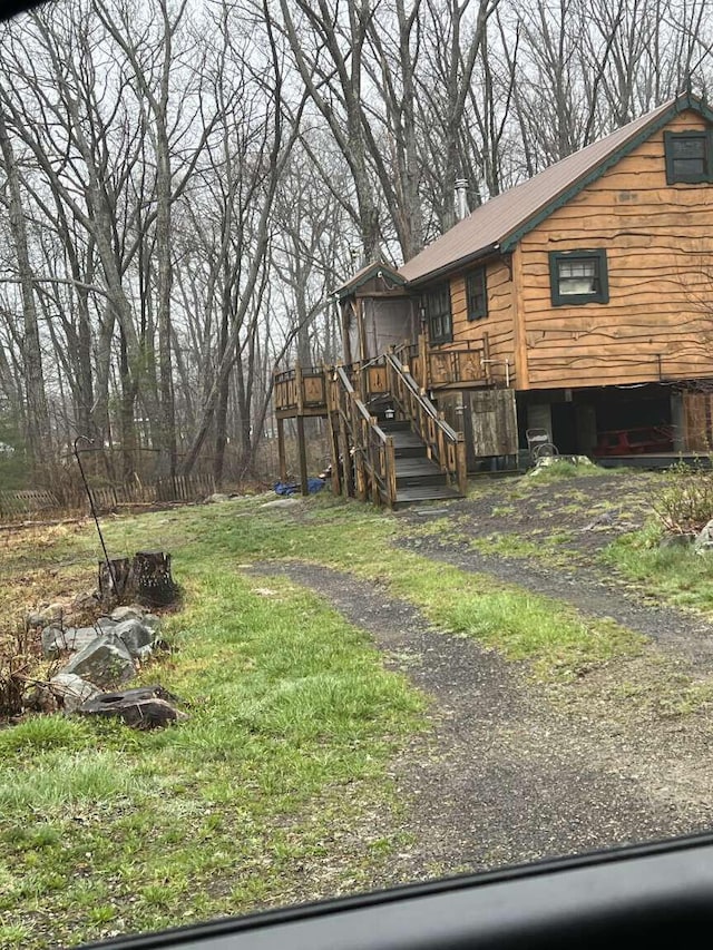 exterior space featuring a deck and stairway