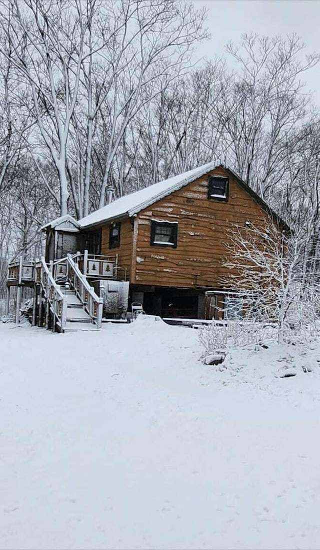 exterior space with stairway and a wooden deck