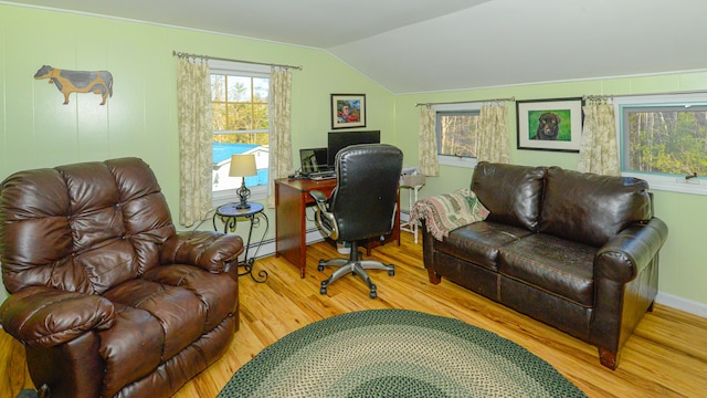 office featuring hardwood / wood-style floors, baseboard heating, and lofted ceiling