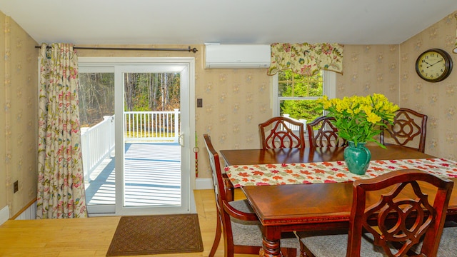 dining space featuring an AC wall unit