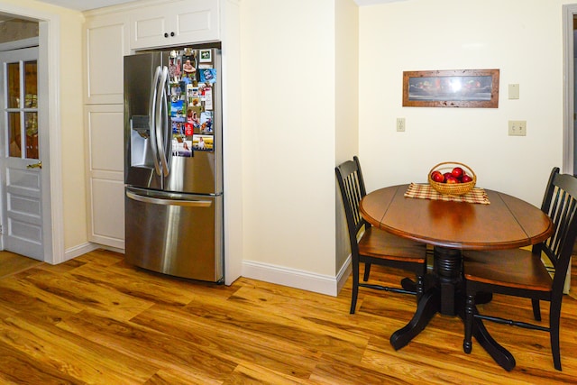 dining space featuring light hardwood / wood-style floors