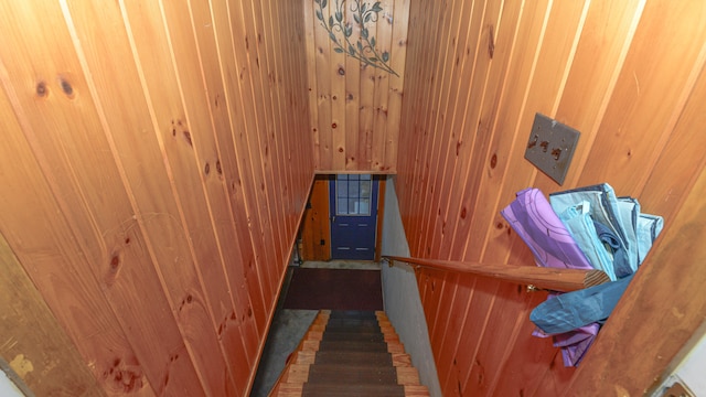 stairway with wooden walls