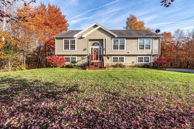 split foyer home with a front lawn