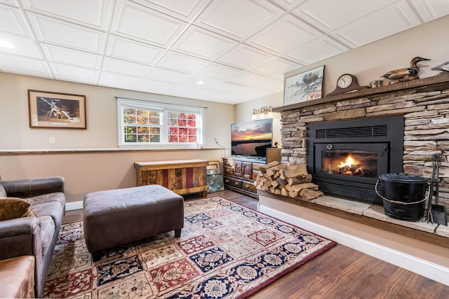 living room with hardwood / wood-style floors and a fireplace