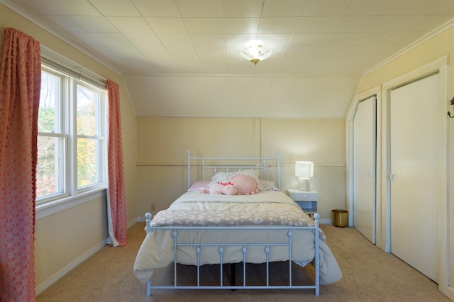 carpeted bedroom featuring lofted ceiling