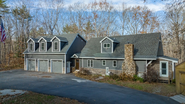 cape cod house with a garage