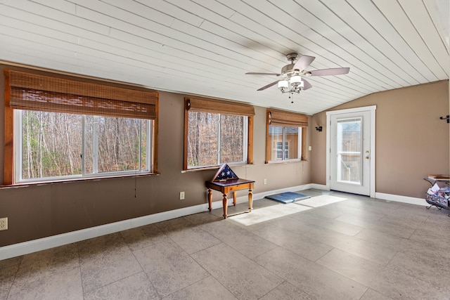 interior space with ceiling fan, vaulted ceiling, wood ceiling, and light tile patterned flooring