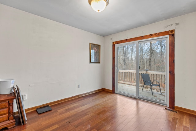 unfurnished room featuring hardwood / wood-style floors