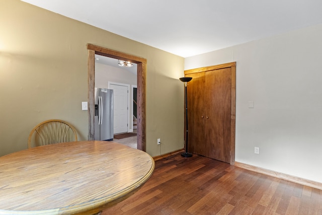 dining space featuring dark wood-type flooring