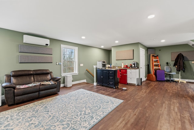 living room featuring an AC wall unit and dark hardwood / wood-style flooring