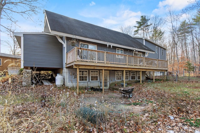 back of property featuring a wooden deck