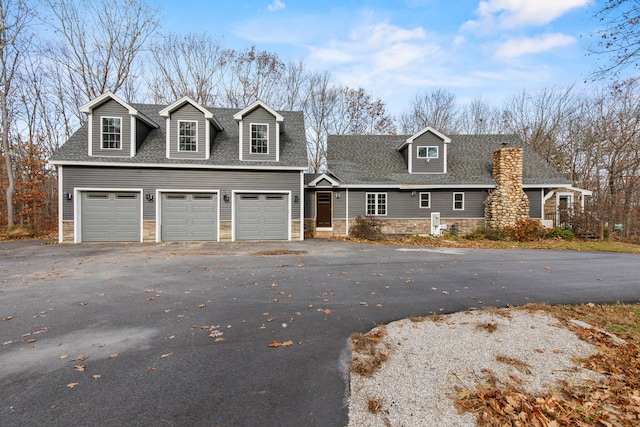 cape cod home with a garage