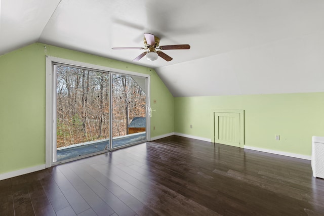 additional living space with ceiling fan, wood-type flooring, and vaulted ceiling