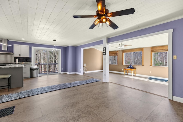 unfurnished living room featuring wooden ceiling, ceiling fan, and crown molding