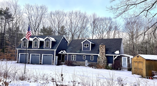 cape cod house featuring a garage