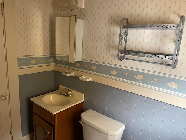 bathroom featuring toilet and vanity