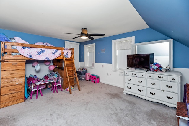 bedroom with light carpet, ceiling fan, and vaulted ceiling