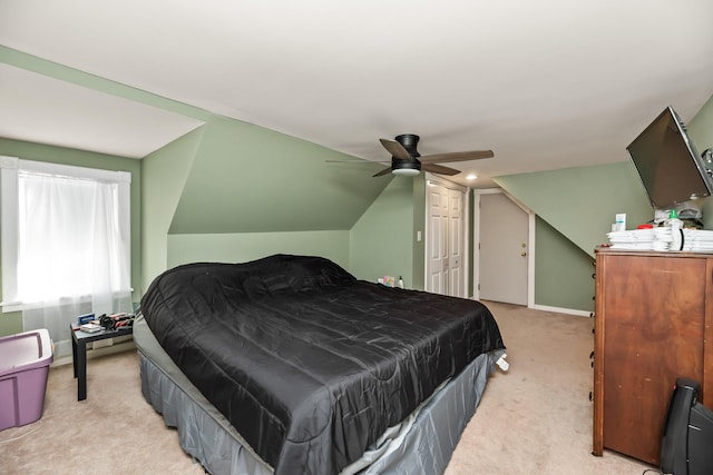 carpeted bedroom with ceiling fan and lofted ceiling