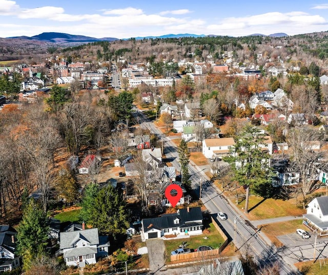 birds eye view of property featuring a mountain view