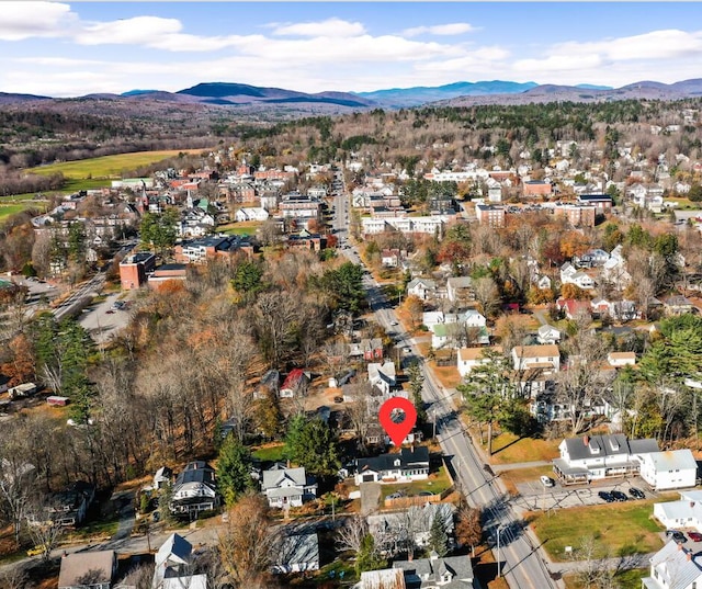 birds eye view of property with a mountain view