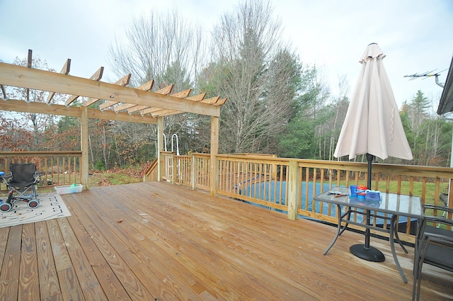 wooden deck featuring a pergola