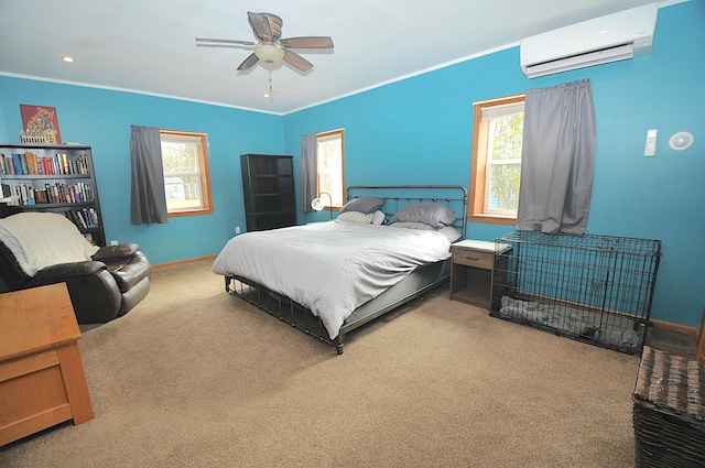 bedroom with a wall unit AC, ceiling fan, carpet flooring, and ornamental molding