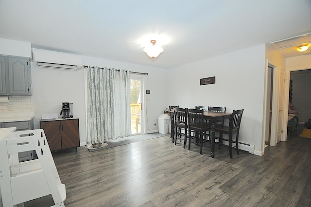 dining space featuring dark hardwood / wood-style flooring, a wall mounted air conditioner, and a baseboard radiator