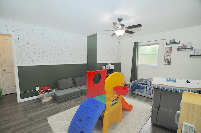 recreation room featuring dark wood-type flooring and ceiling fan