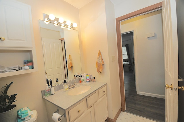 bathroom with vanity and wood-type flooring