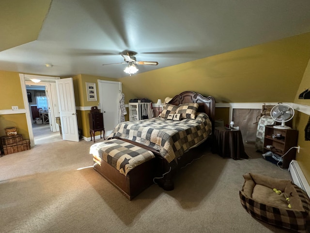 bedroom featuring ceiling fan, a baseboard radiator, lofted ceiling, and light colored carpet