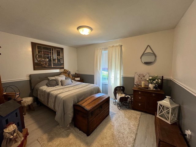 bedroom featuring wood-type flooring