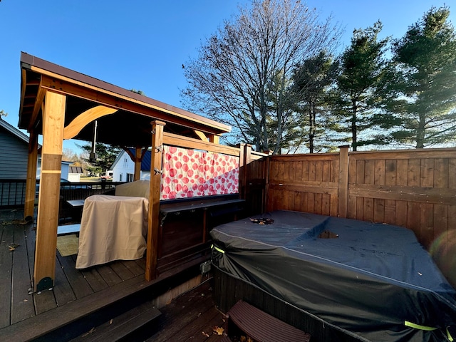 deck featuring a jacuzzi