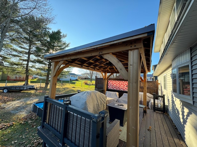 deck featuring a lawn and a gazebo