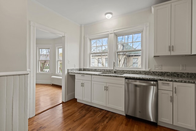 kitchen with dishwasher, white cabinetry, and sink