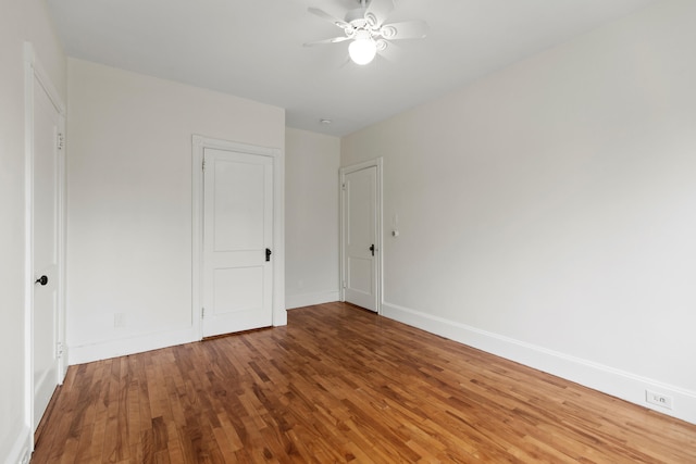 unfurnished bedroom with hardwood / wood-style flooring and ceiling fan